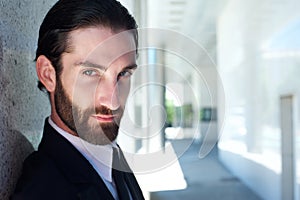 Close up portrait of a serious male fashion model with beard