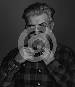 Close-up portrait of serious man model with mustaches and beard in shirt. Portrait Handsome Business man with confident