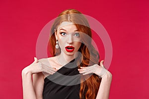 Close-up portrait of shocked gorgeous redhead woman look with disbelief and shook, questioned pointing at herself, being