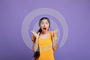 Close up portrait of shocked young indian woman screaming