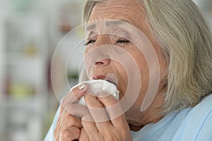 Close up portrait of sick senior woman