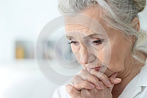 Close up portrait of a sick senior woman