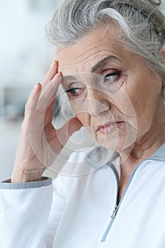 Close up portrait of a sick senior woman