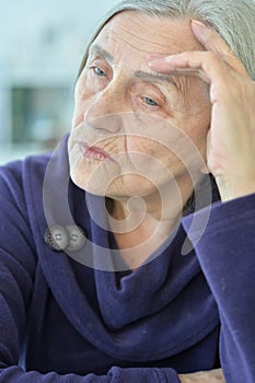 Close up portrait of a sick senior woman