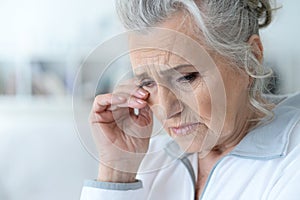 Close up portrait of a sick senior woman