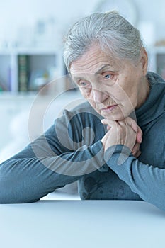 Close up portrait of a sick senior woman