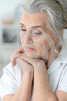 Close up portrait of a sick senior woman