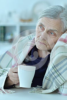 Close up portrait of a sick senior woman