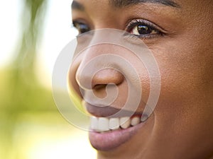 Close Up Portrait Of Smiling Beautiful Woman Standing Outdoors