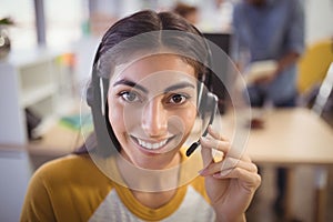 Close up portrait of smiling female customer service representative