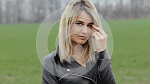 Close up portrait of smiling and flirting biker girl