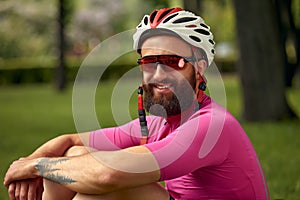 Close up portrait of smiling handsome bearded male athlete