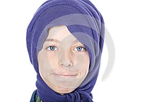 Close up portrait of a smiling male teenager with blue scarf on