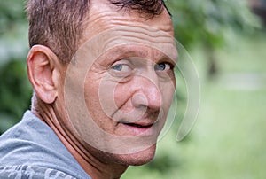 Close up portrait of smiling middle aged man