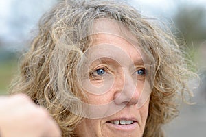 Close up portrait of smiling middle aged woman