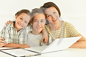 Close up portrait of smiling mother with children