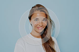 Close up portrait of smiling stylish young beautiful woman