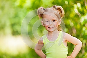 Close-up portrait of smiling three years old girl
