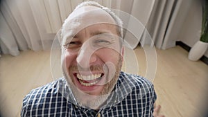 Close up portrait of smiling young man laughing