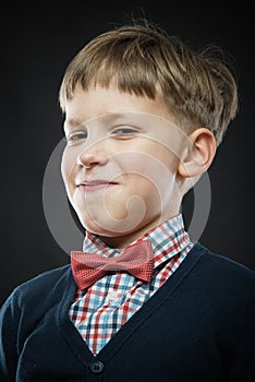 Close up portrait of smug boy