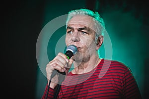 Close-up portrait of standup actor comedian on stage