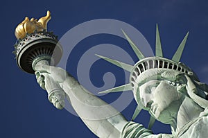 Close-up Portrait of Statue of Liberty Bright Blue Sky Torch