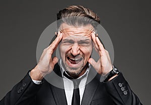 Close up portrait of a stressed mature businessman