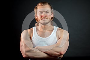 Close up portrait of strong fitness man with brown hair