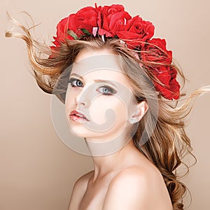 Close-up portrait of summer teenage girl with flower hairstyle.