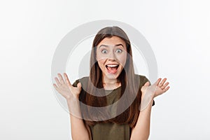 Close-up portrait of surprised beautiful girl holding her head in amazement and open-mouthed. Over white background