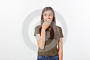 Close-up portrait of surprised beautiful girl holding her head in amazement and open-mouthed. Over white background