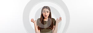 Close-up portrait of surprised beautiful girl holding her head in amazement and open-mouthed. Over white background