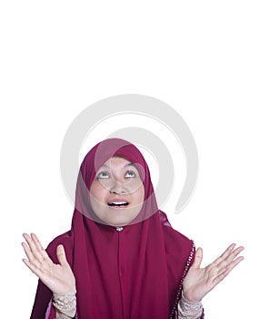 Close-up portrait of surprised beautiful muslim girl and open-mouthed. Over white background.