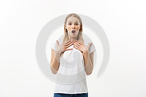 Close-up portrait of surprised beautiful young girl holding her head in amazement and open-mouthed. Isolated over white