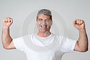 Close up portrait of surprised and happy man celebrating victory and wining lottery