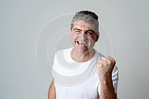 Close up portrait of surprised and happy man celebrating victory and wining lottery