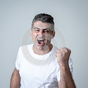 Close up portrait of surprised and happy man celebrating victory and wining lottery