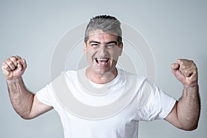 Close up portrait of surprised and happy man celebrating victory and wining lottery