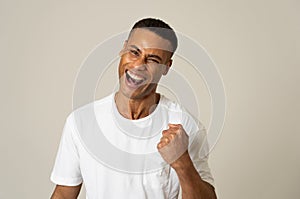 Close up portrait of surprised and happy man celebrating victory and wining team or lottery