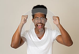 Close up portrait of surprised and happy man celebrating victory and wining team or lottery