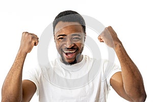 Close up portrait of surprised and happy man celebrating victory and wining team or lottery