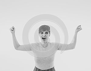 Close up portrait of surprised and happy woman celebrating victory and wining lottery