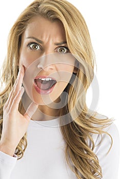 Close-Up Portrait Of Surprised Woman Shouting