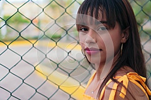 Close-up portrait of a teenage girl relaxing in the park