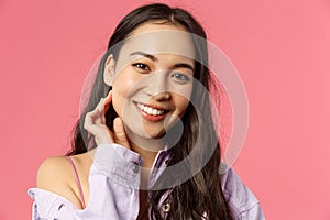 Close-up portrait of tender, beautiful young asian woman with clean skin, no pimples or blemishes, smiling lovely camera photo