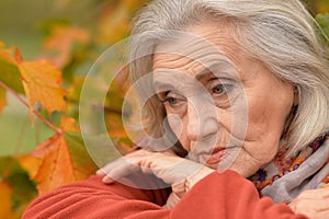 Close up portrait of thoughtful senior woman