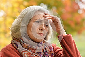 Close up portrait of thoughtful senior woman