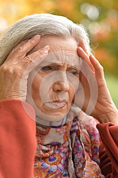 Close up portrait of thoughtful senior woman