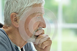Close up portrait of thougthful senior man close up portrait isolated on white background