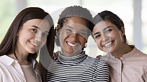 Close up portrait of three beautiful multiethnic girls